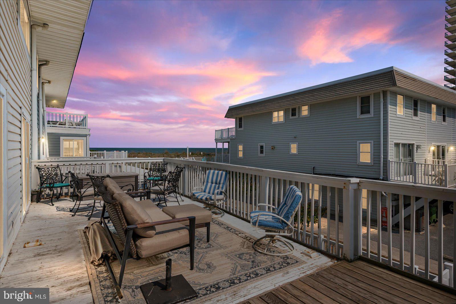 11602 Coastal Highway, Unit 1A Ocean City, MD 21842 - Photo 2 of 83 a terrace of a house with outdoor seating