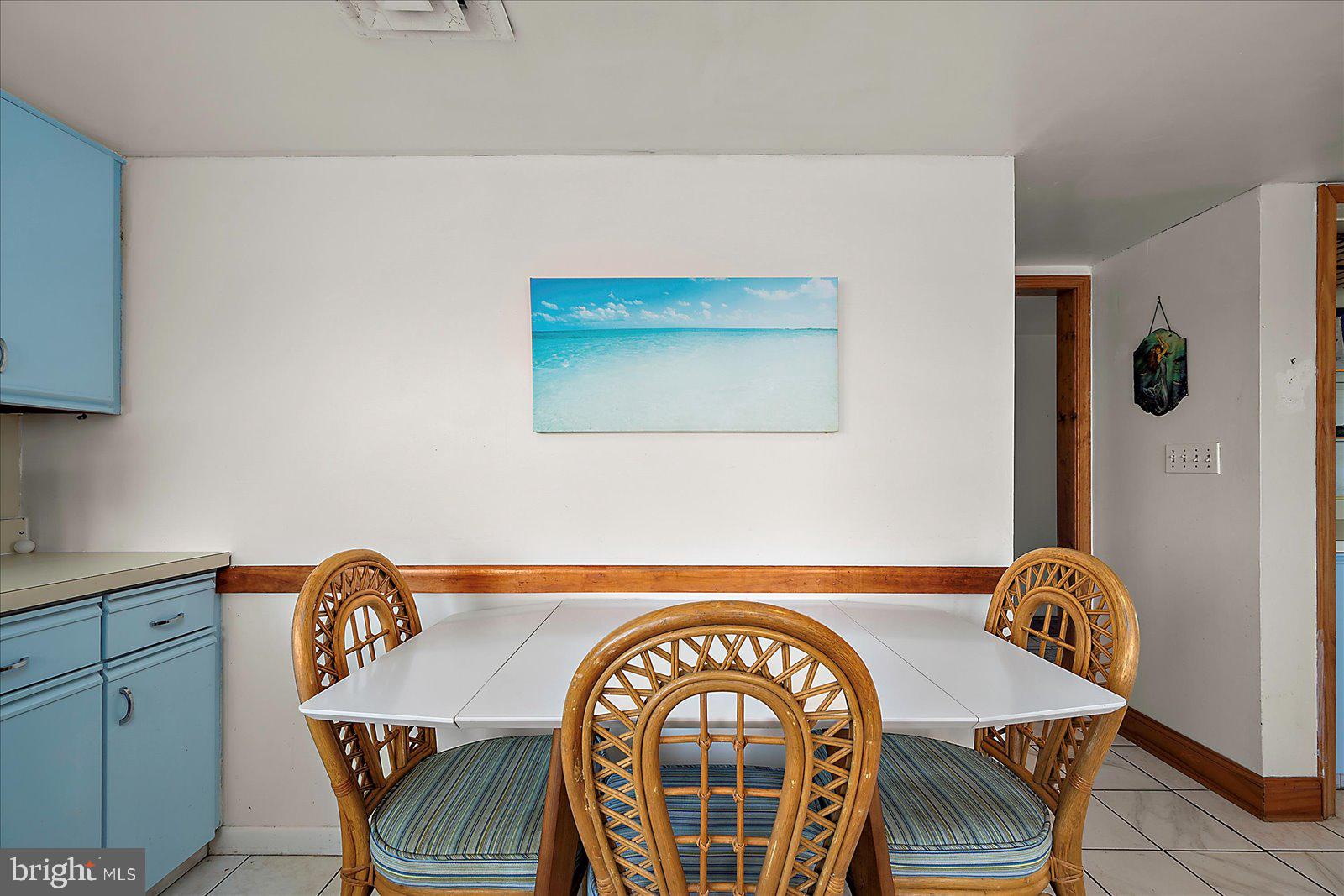 11602 Coastal Highway, Unit 1A Ocean City, MD 21842 - Photo 21 of 83 a view of dining room and wooden floor
