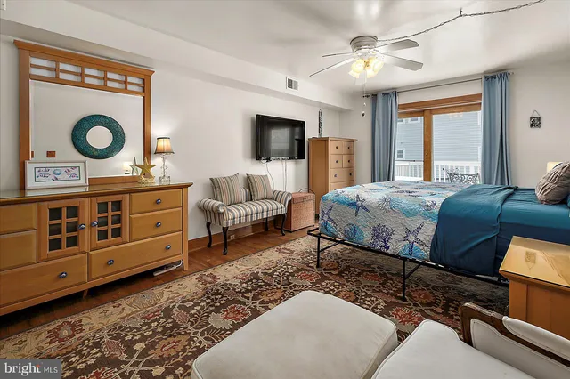 a bedroom with a bed and a dresser