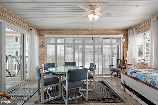 a view of a balcony with wooden floor and fence