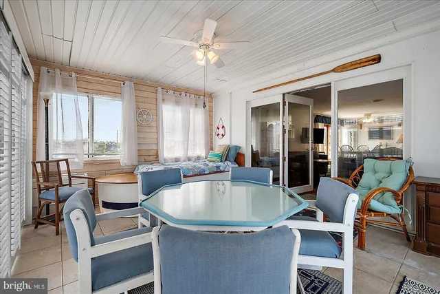 a living room with furniture a rug and a chandelier