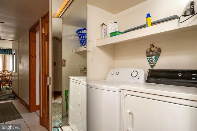 a kitchen with cabinets stainless steel appliances and a counter space