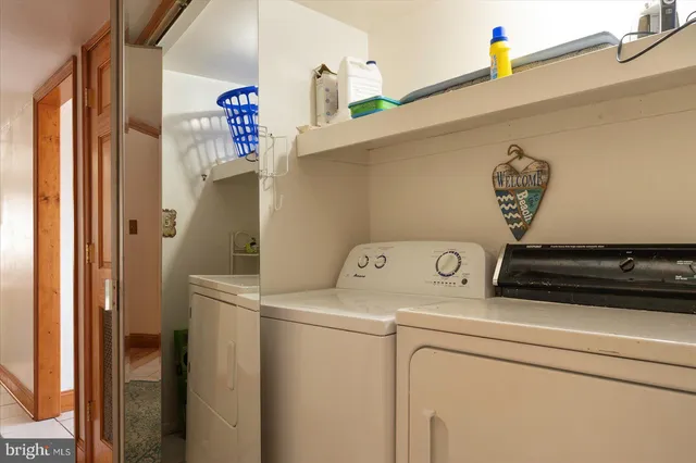 a dining room with furniture a window and a kitchen view