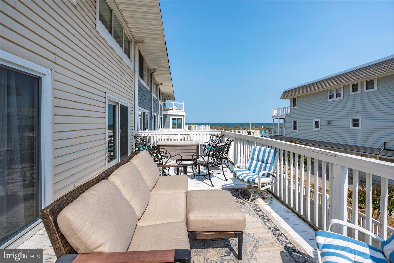 11602 Coastal Highway, Unit 1A Ocean City, MD 21842 - Photo 44 of 83 a view of a chairs and table in the balcony