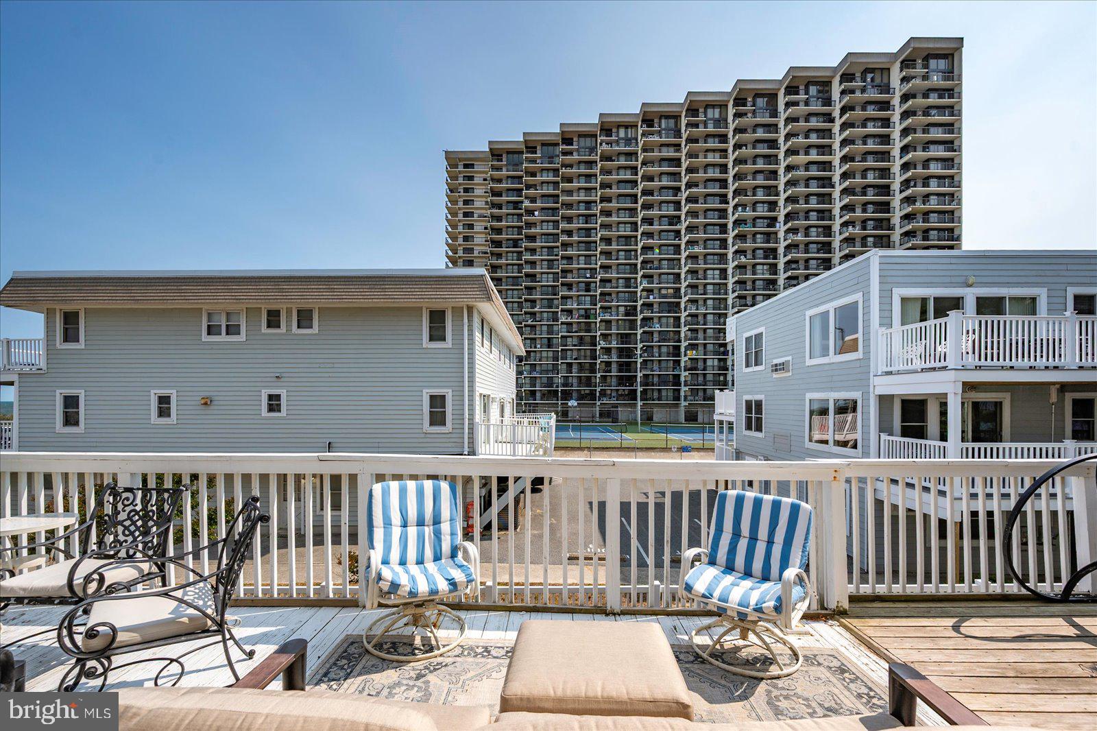 11602 Coastal Highway, Unit 1A Ocean City, MD 21842 - Photo 47 of 83 a front view of a building with glass door