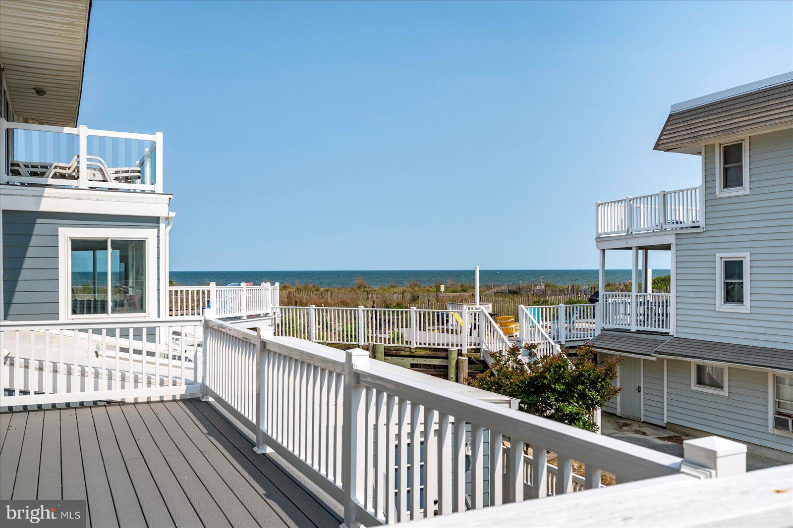 11602 Coastal Highway, Unit 1A Ocean City, MD 21842 - Photo 49 of 83 a view of a balcony with wooden floor and fence