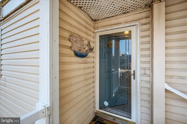 a view of a door and a window