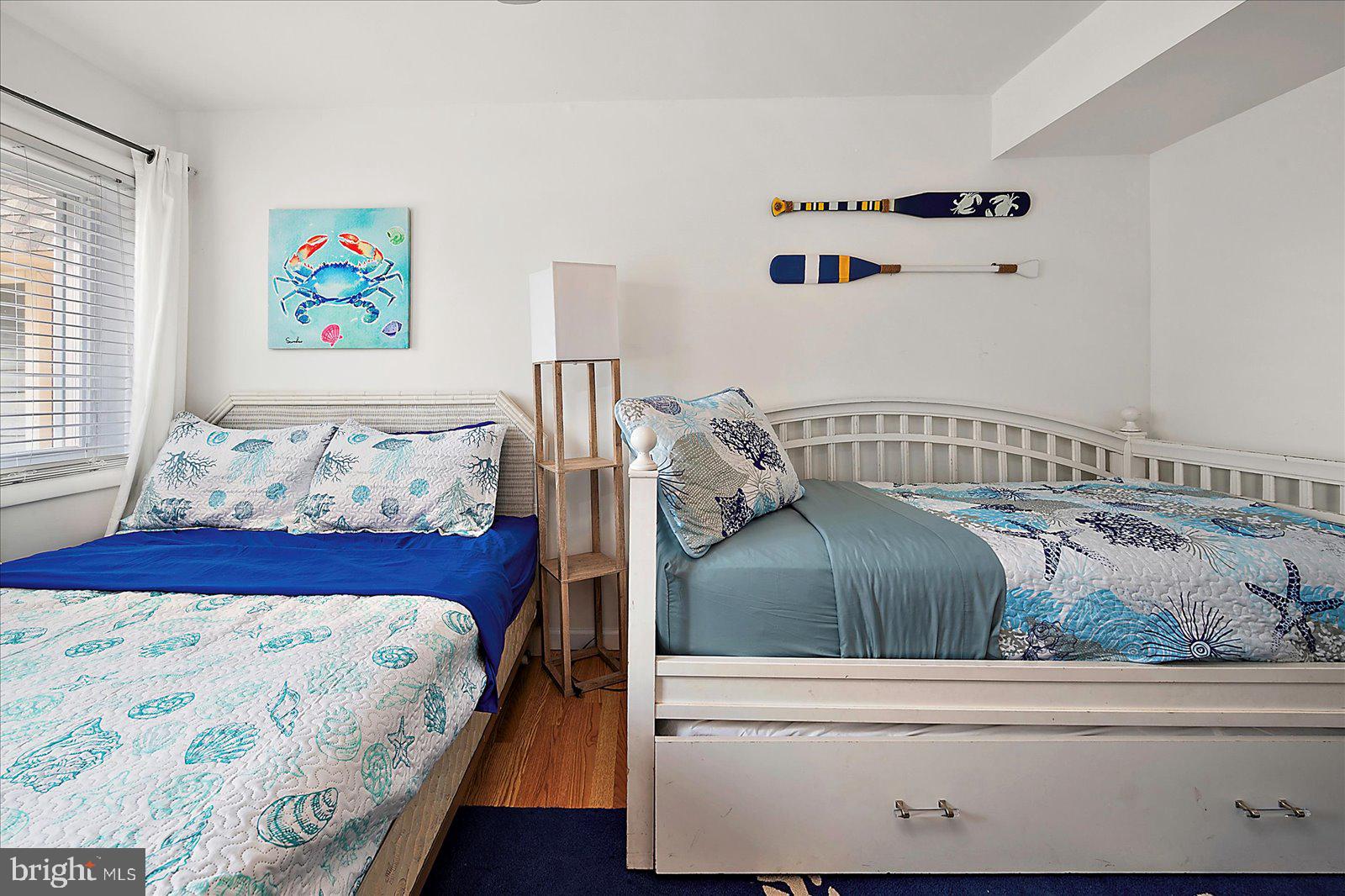 11602 Coastal Highway, Unit 1A Ocean City, MD 21842 - Photo 68 of 83 a bedroom with a bed and window