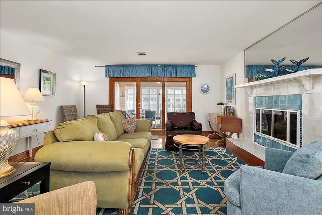 a living room with furniture fireplace and a flat screen tv