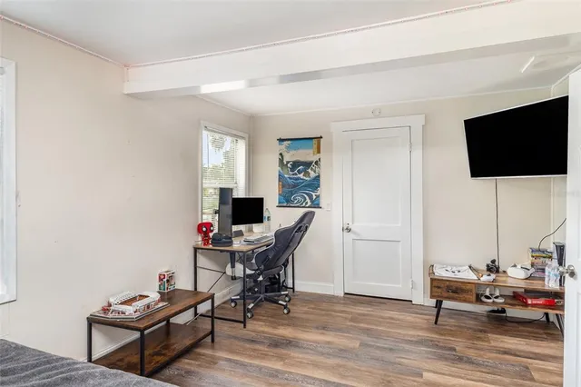 a bedroom with bed and a window