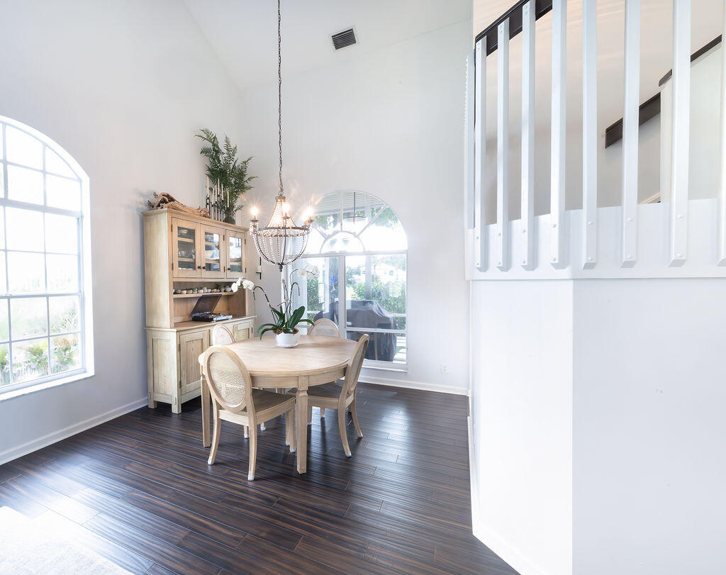 18157 Southeast Fairview Circle Jupiter, FL 33469 - Photo 13 of 27 a view of a dining room with furniture window and wooden floor