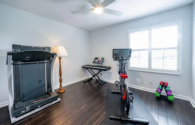 a view of a livingroom with gym equipment