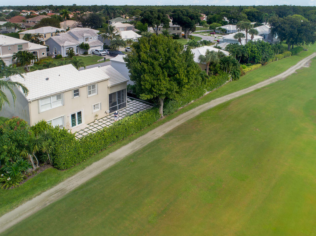 18157 Southeast Fairview Circle Jupiter, FL 33469 - Photo 2 of 27 an aerial view of residential houses with outdoor space and trees