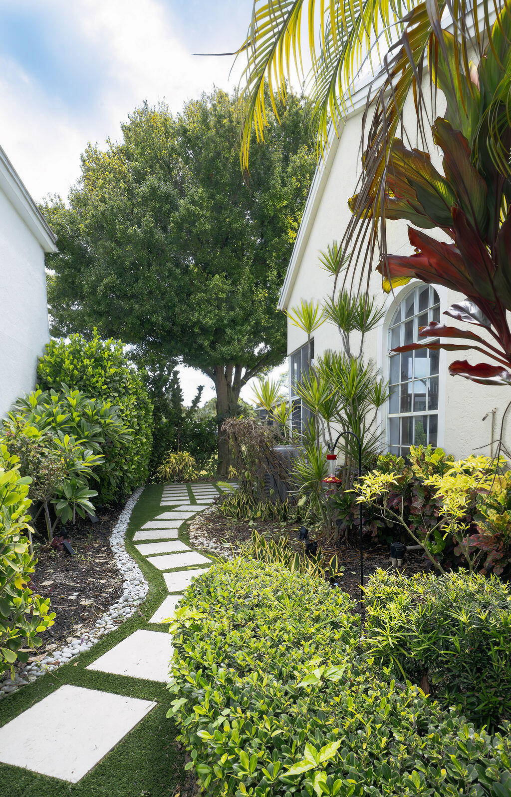 18157 Southeast Fairview Circle Jupiter, FL 33469 - Photo 22 of 27 a backyard of a house with lots of green space