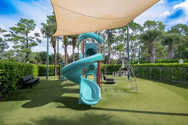 a view of a park with a slide