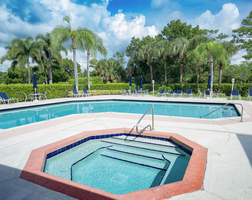 18157 Southeast Fairview Circle Jupiter, FL 33469 - Photo 26 of 27 a view of a swimming pool with a yard