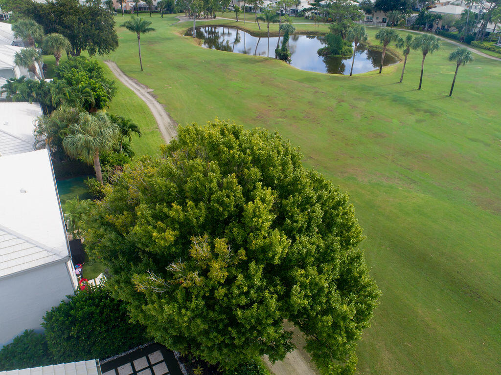 18157 Southeast Fairview Circle Jupiter, FL 33469 - Photo 4 of 27 an aerial view of residential houses with outdoor space and trees