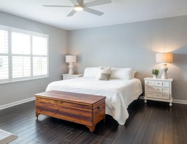 a bedroom with bed and window