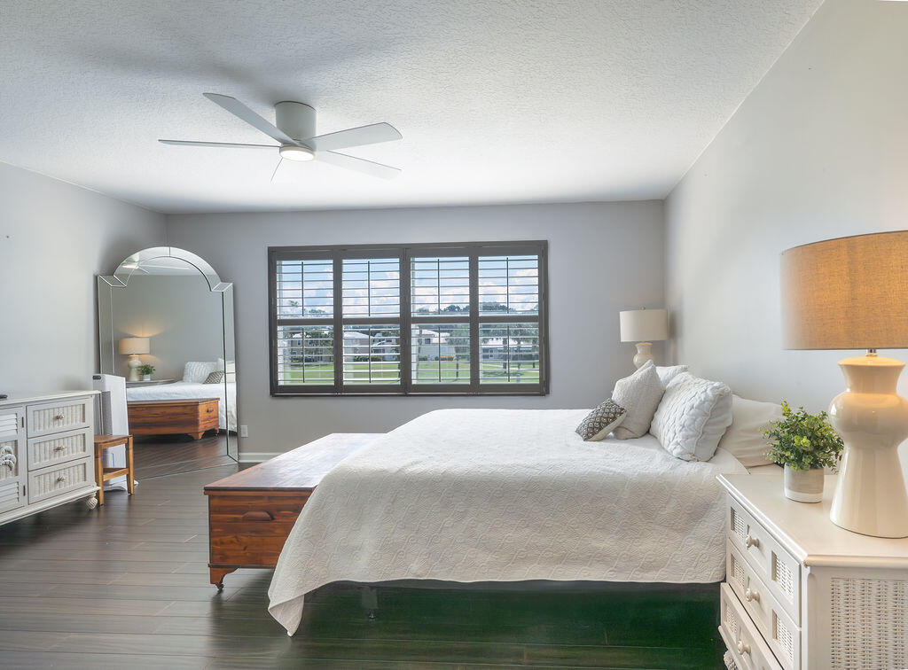 18157 Southeast Fairview Circle Jupiter, FL 33469 - Photo 6 of 27 a bedroom with bed and a large window