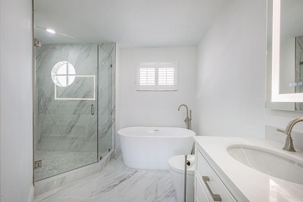 18157 Southeast Fairview Circle Jupiter, FL 33469 - Photo 7 of 27 a bathroom with a sink toilet and shower