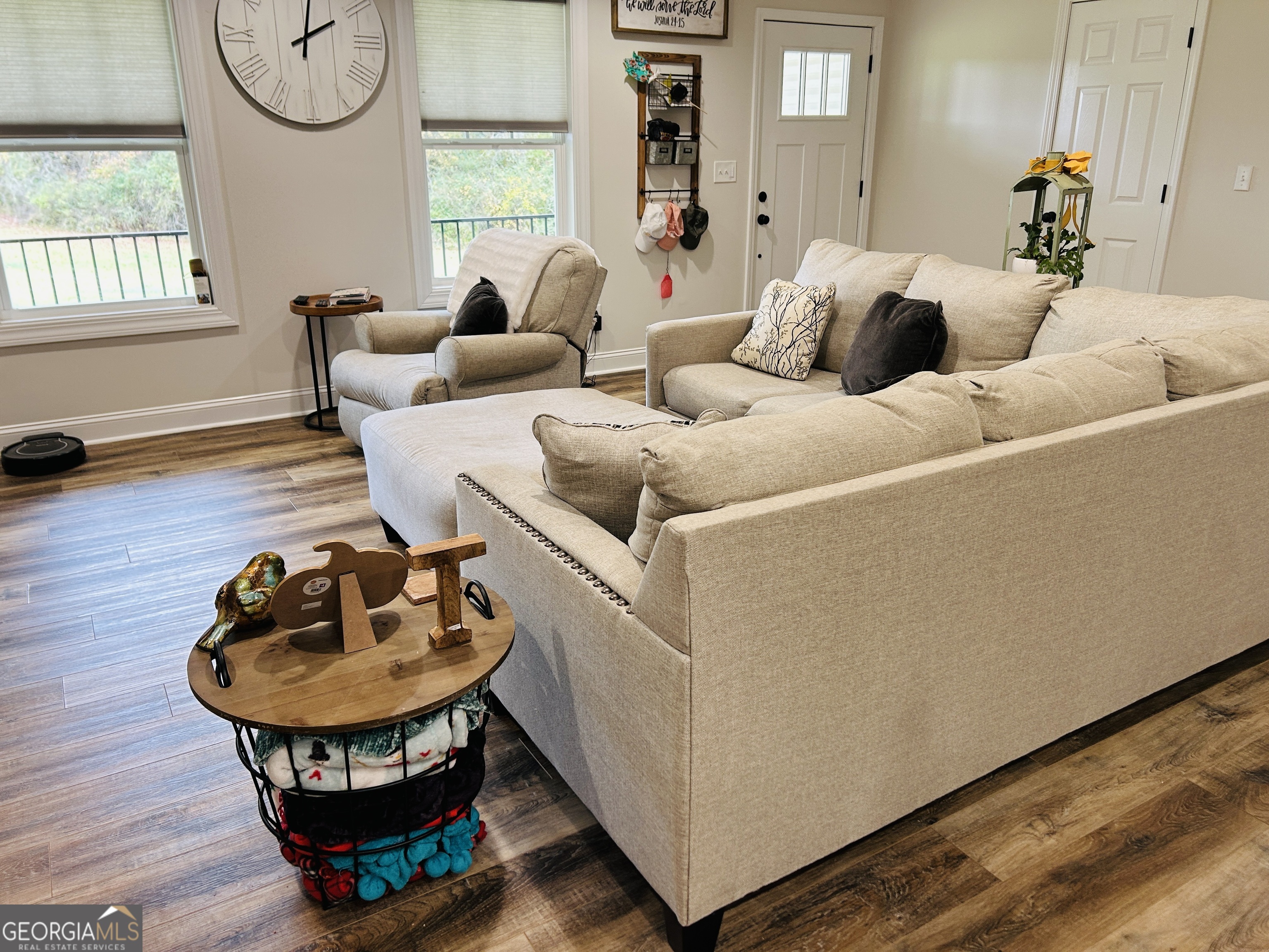 3077 Alec Mountain Road Clarkesville, GA 30523 - Photo 10 of 35 a living room with furniture a window and a wooden floor