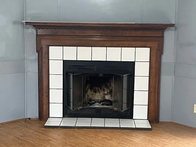 a view of fireplace and wooden floor