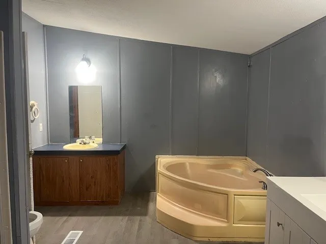 a bathroom with a sink and mirror