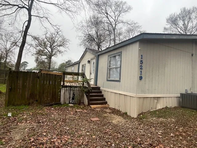 a house with trees in the background