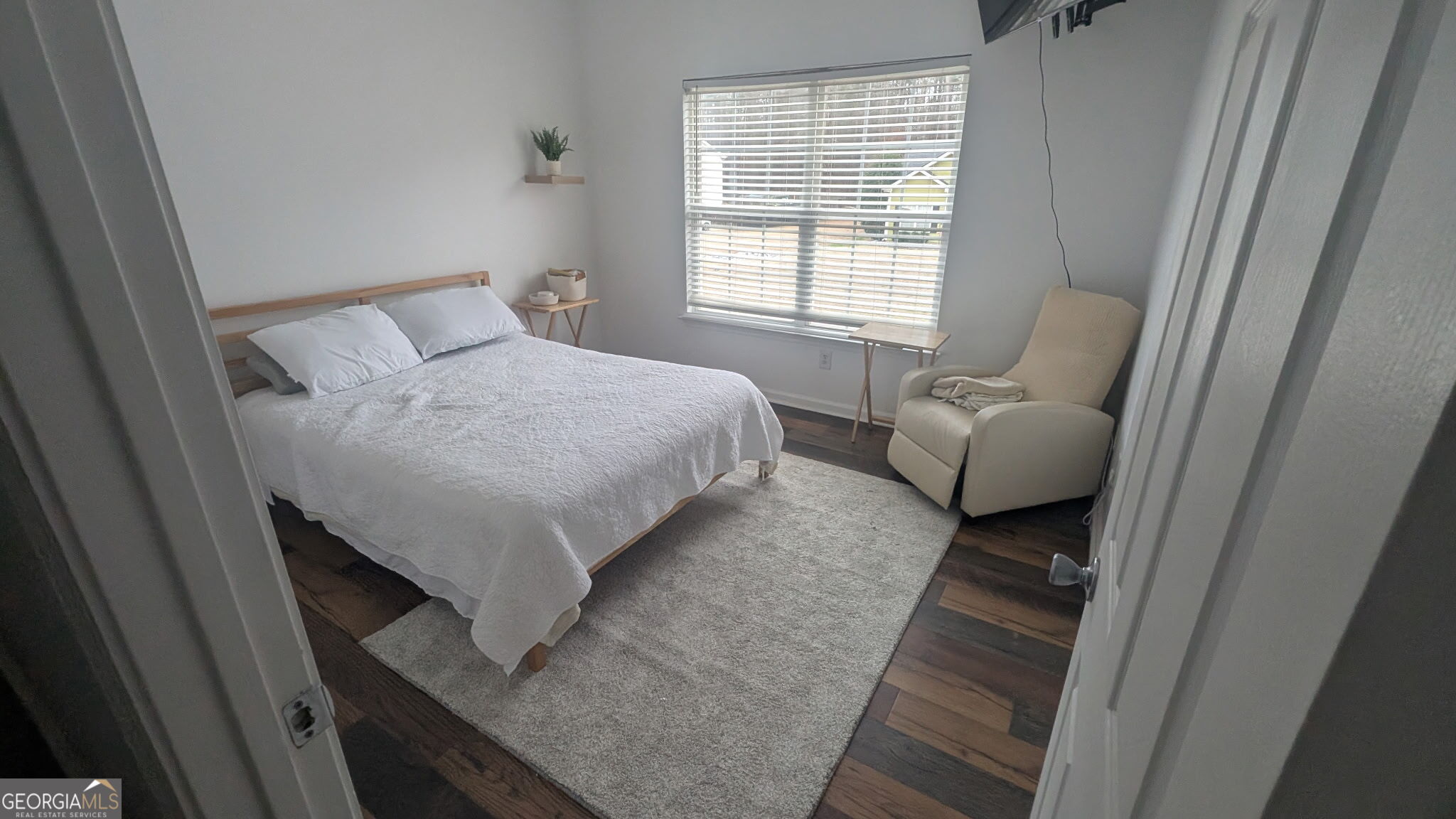 48 Highlander Trail Southwest Rome, GA 30165 - Photo 19 of 45 a bed sitting in a bedroom next to a window