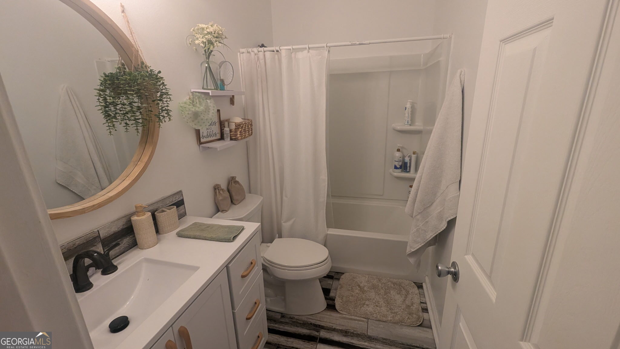 48 Highlander Trail Southwest Rome, GA 30165 - Photo 21 of 45 a bathroom with a sink a toilet and shower