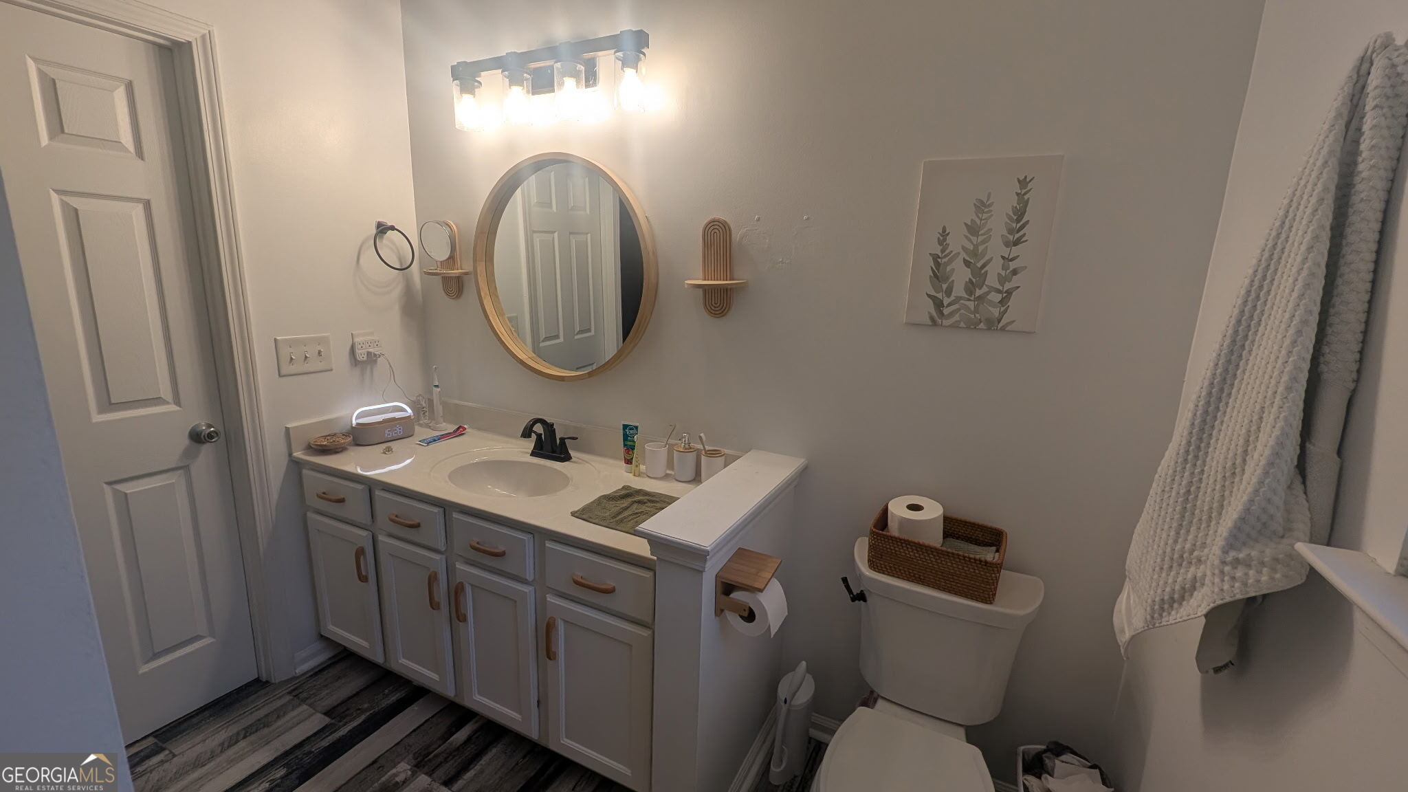 48 Highlander Trail Southwest Rome, GA 30165 - Photo 23 of 45 a bathroom with a toilet a sink and a mirror