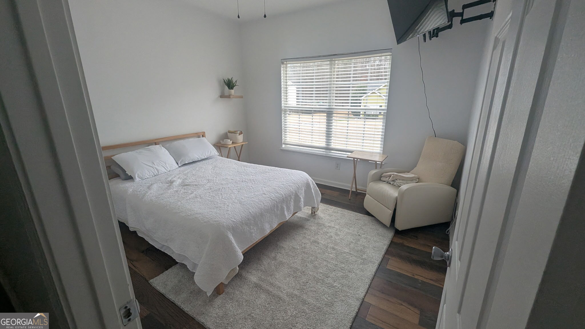 48 Highlander Trail Southwest Rome, GA 30165 - Photo 25 of 45 a bedroom with a bed and a couch