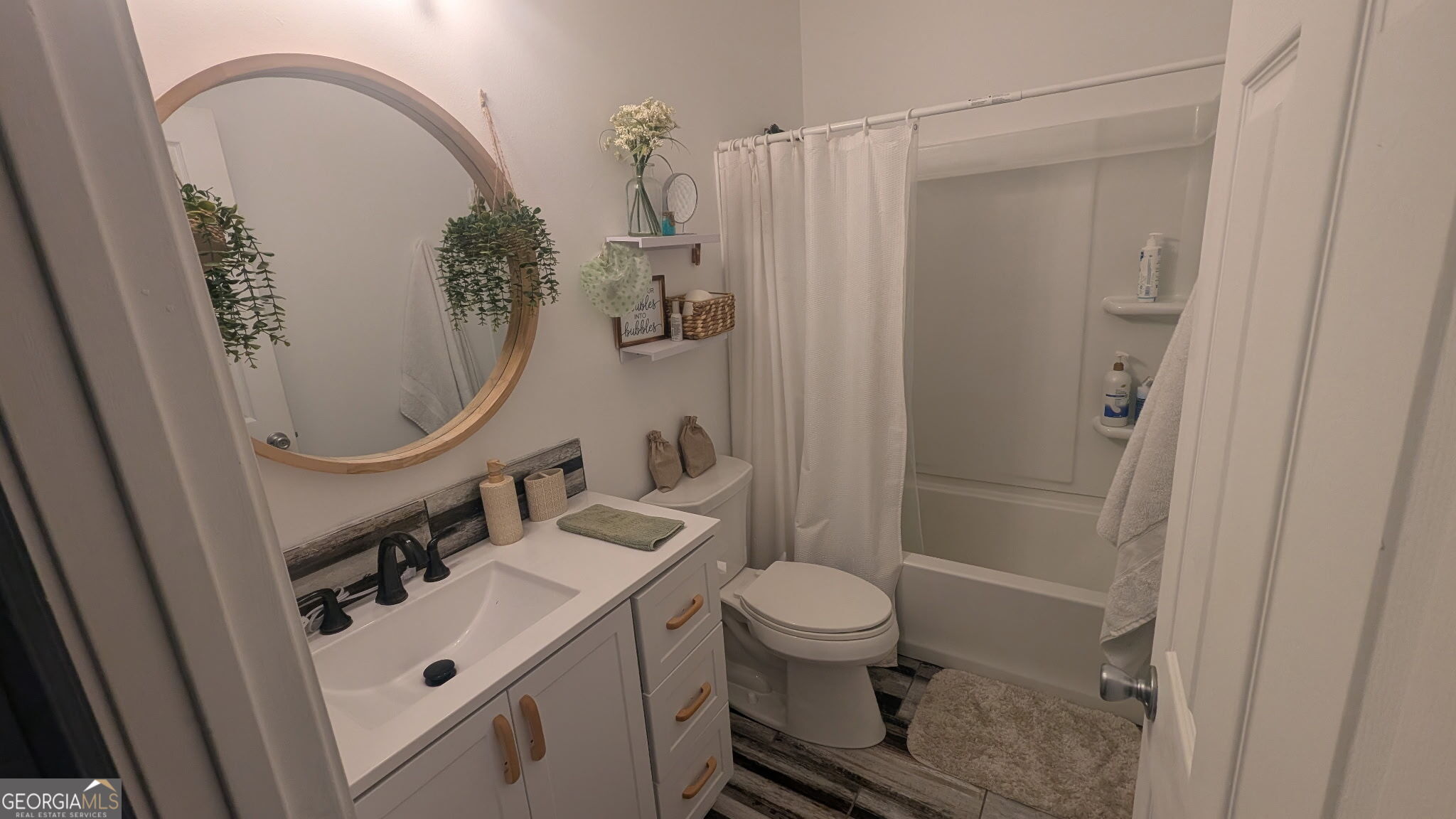 48 Highlander Trail Southwest Rome, GA 30165 - Photo 32 of 45 a bathroom with a sink a toilet and shower