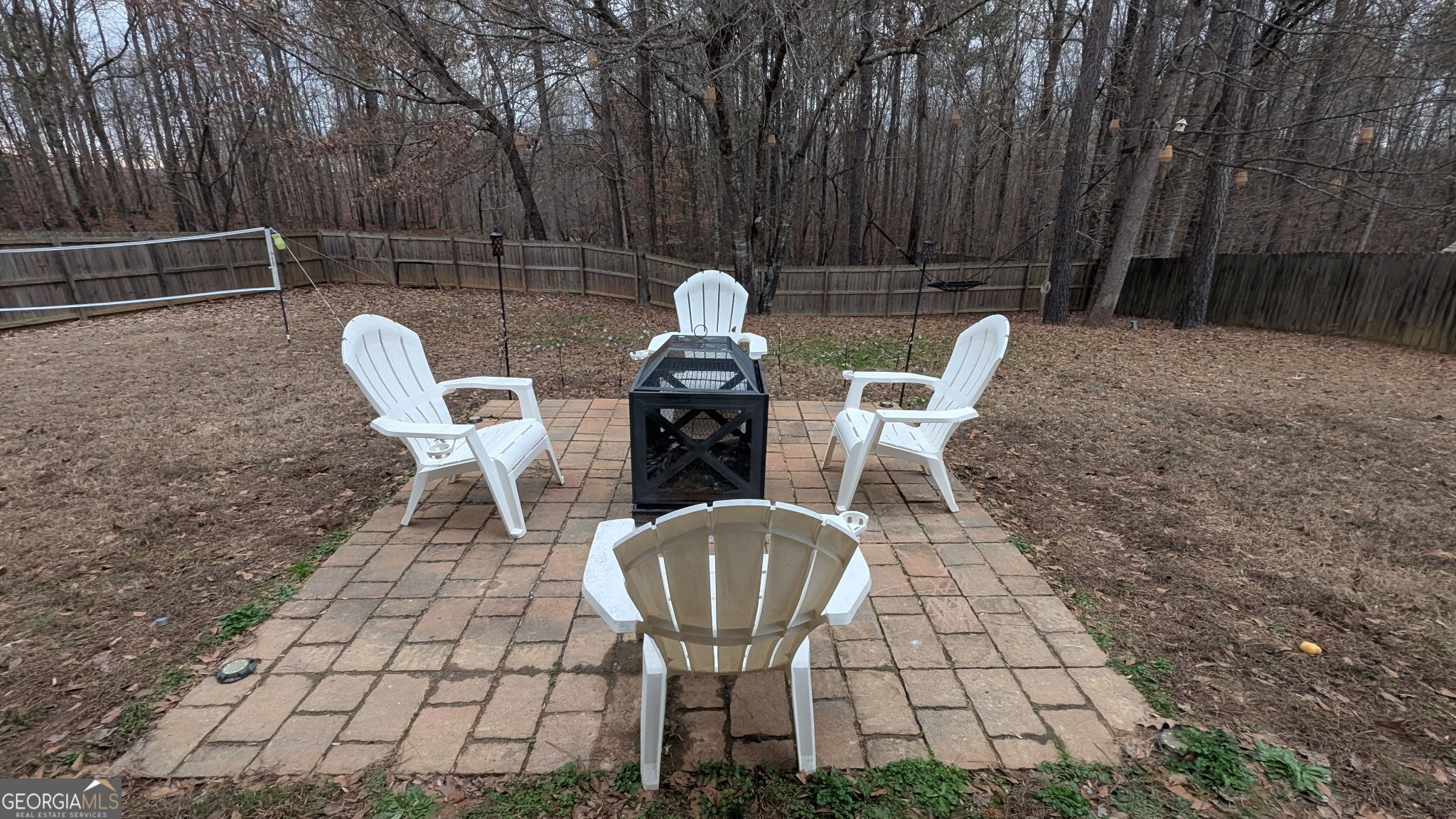 48 Highlander Trail Southwest Rome, GA 30165 - Photo 43 of 45 a view of a chairs and tables in the back yard of the house