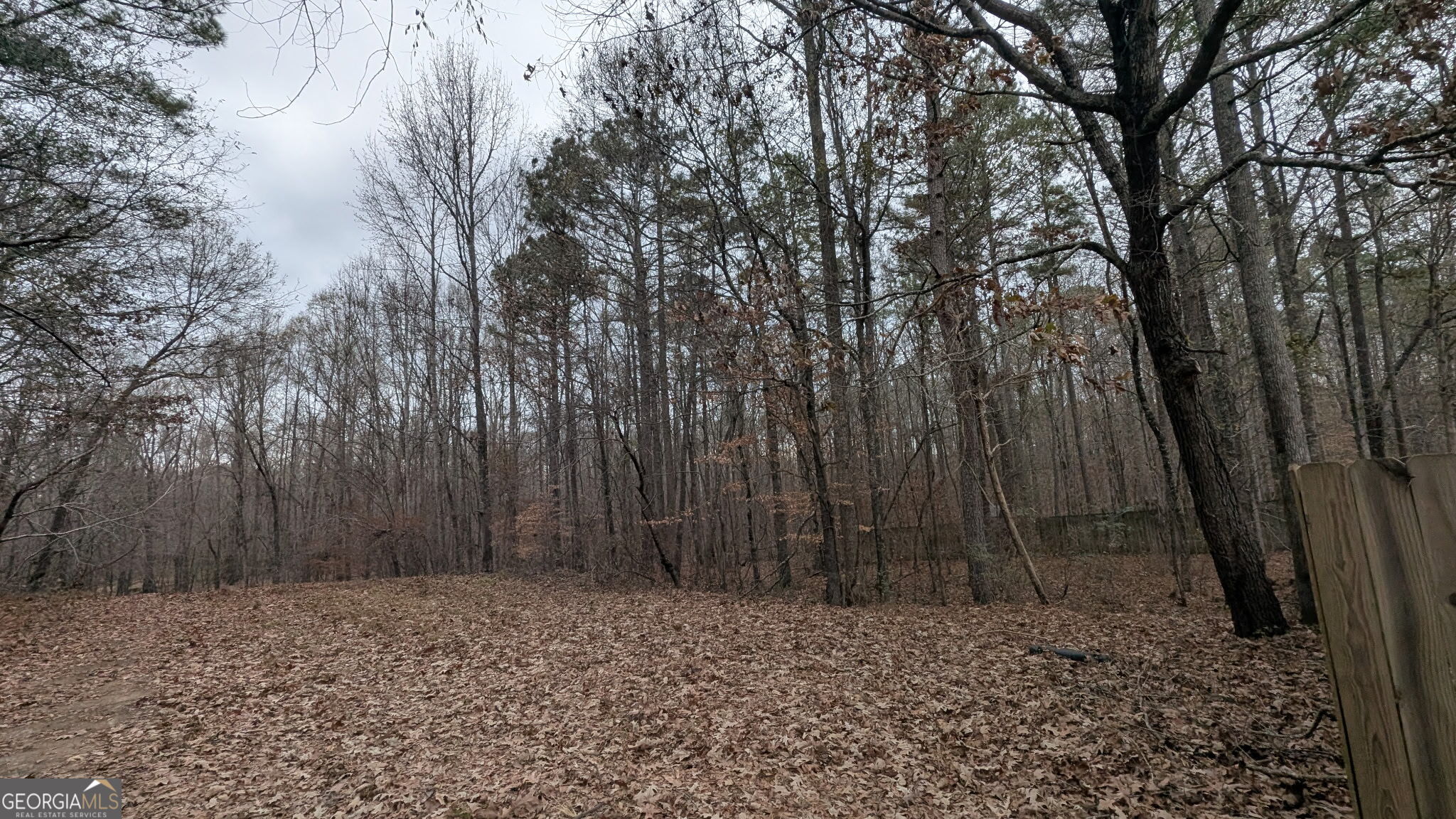 48 Highlander Trail Southwest Rome, GA 30165 - Photo 44 of 45 a wooden fence with trees in the background