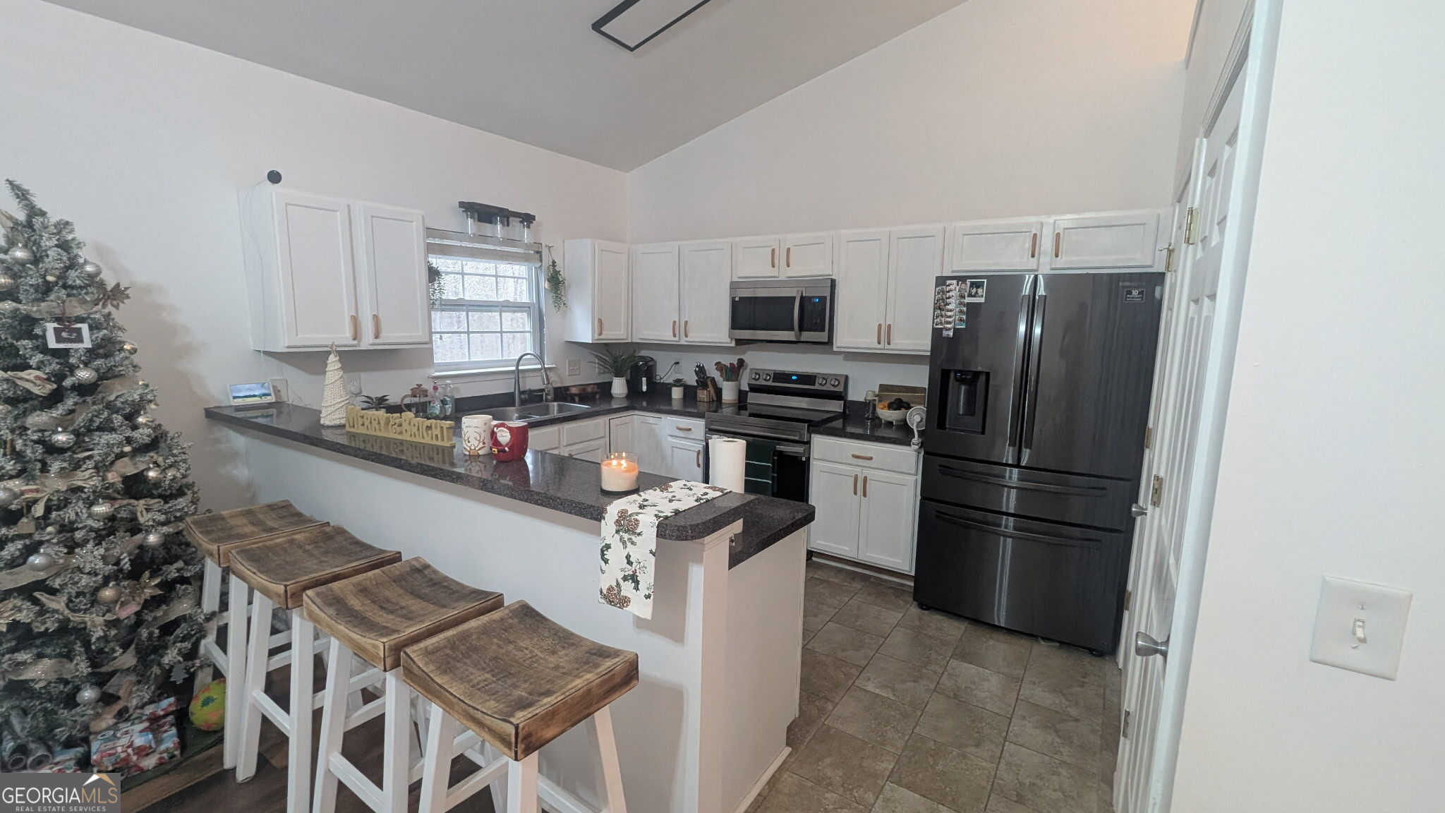 48 Highlander Trail Southwest Rome, GA 30165 - Photo 8 of 45 a kitchen with stainless steel appliances granite countertop a refrigerator stove and microwave