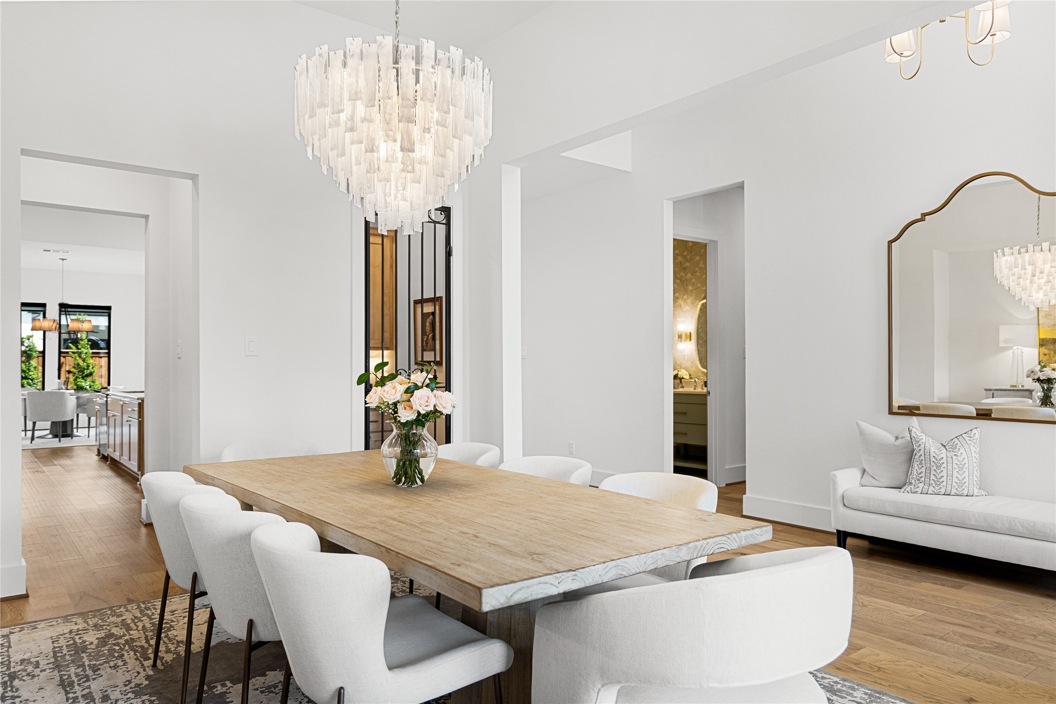 4229 Hollow Wind Way Spring, TX 77386 - Photo 4 of 49 Formal dining framed by updated designer lighting.
