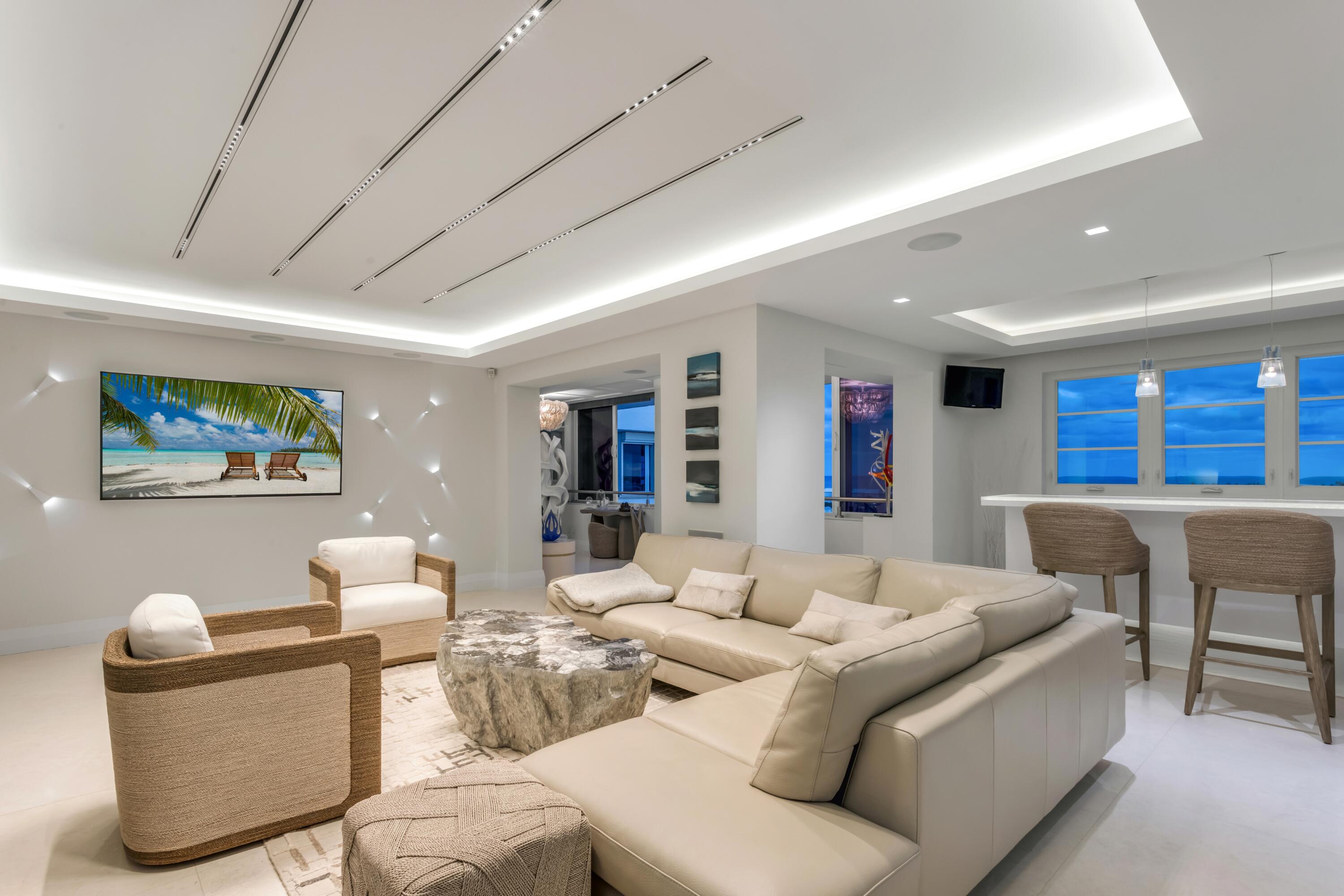 50 E Road, Unit 12G (PENTHOUSE) Delray Beach, FL 33483 - Photo 11 of 75 a living room with furniture and a large window