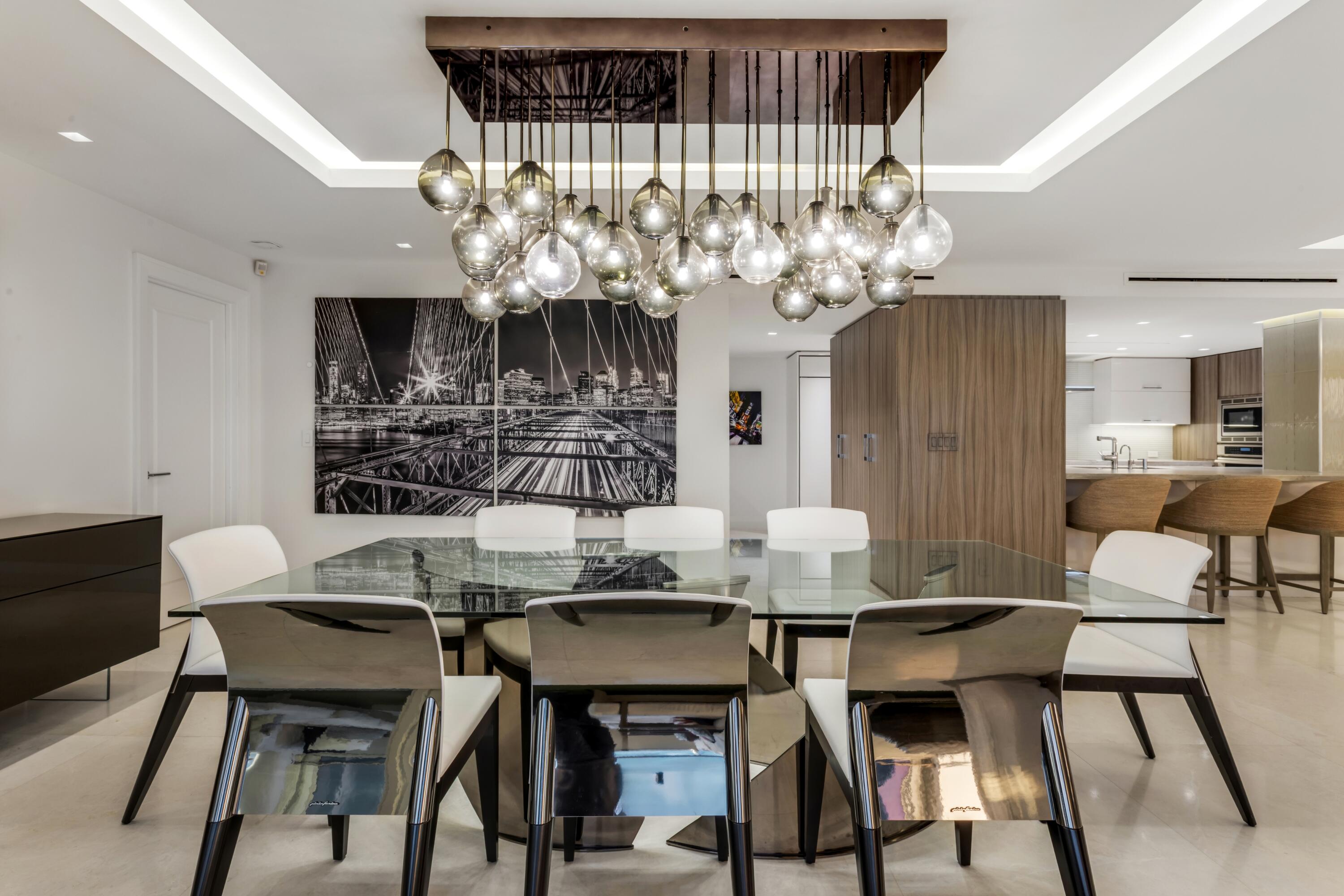 50 E Road, Unit 12G (PENTHOUSE) Delray Beach, FL 33483 - Photo 27 of 75 a view of a dining room with furniture and chandelier
