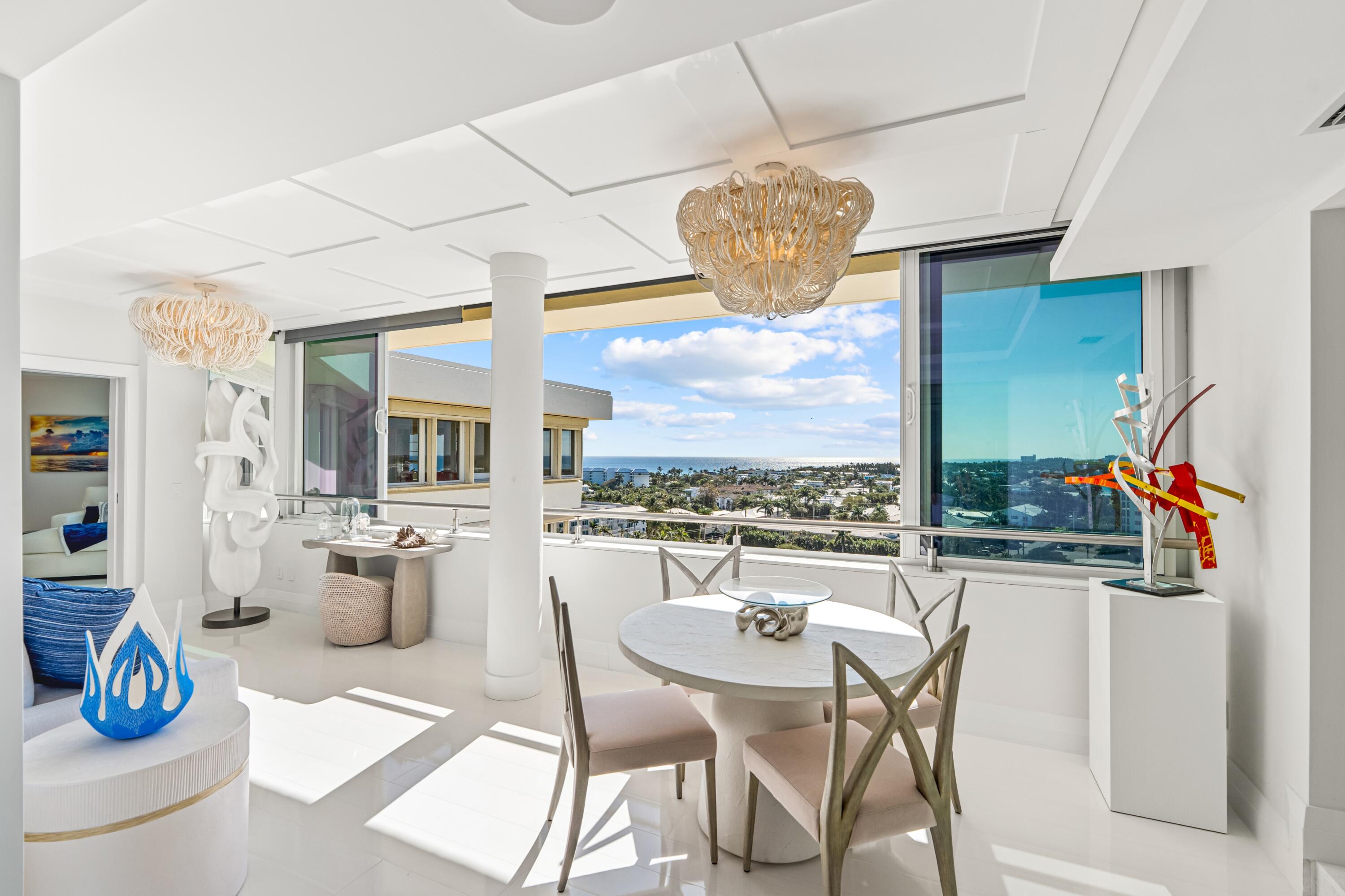50 E Road, Unit 12G (PENTHOUSE) Delray Beach, FL 33483 - Photo 35 of 75 a view of a dining room with furniture wooden floor and chandelier