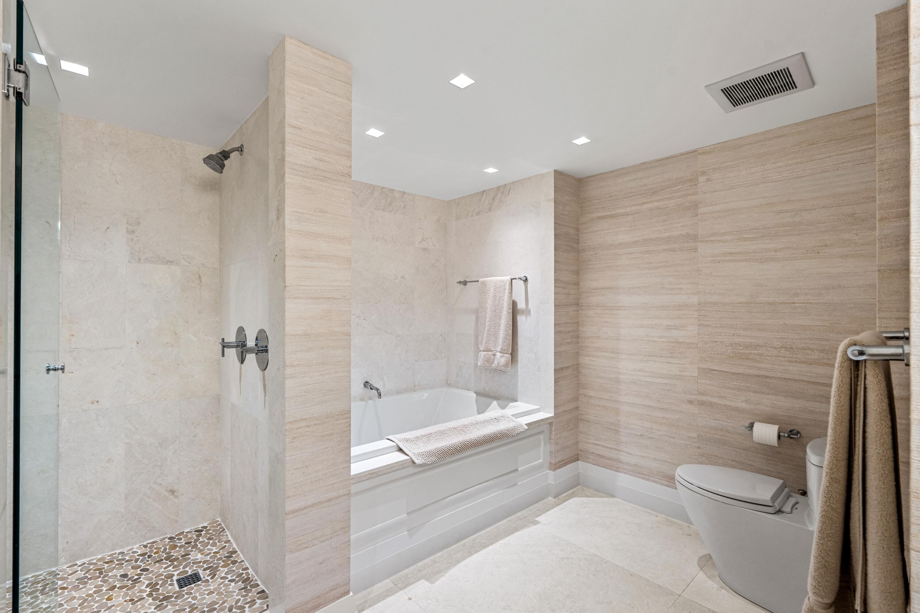 50 E Road, Unit 12G (PENTHOUSE) Delray Beach, FL 33483 - Photo 44 of 75 a bathroom with a bathtub and a shower