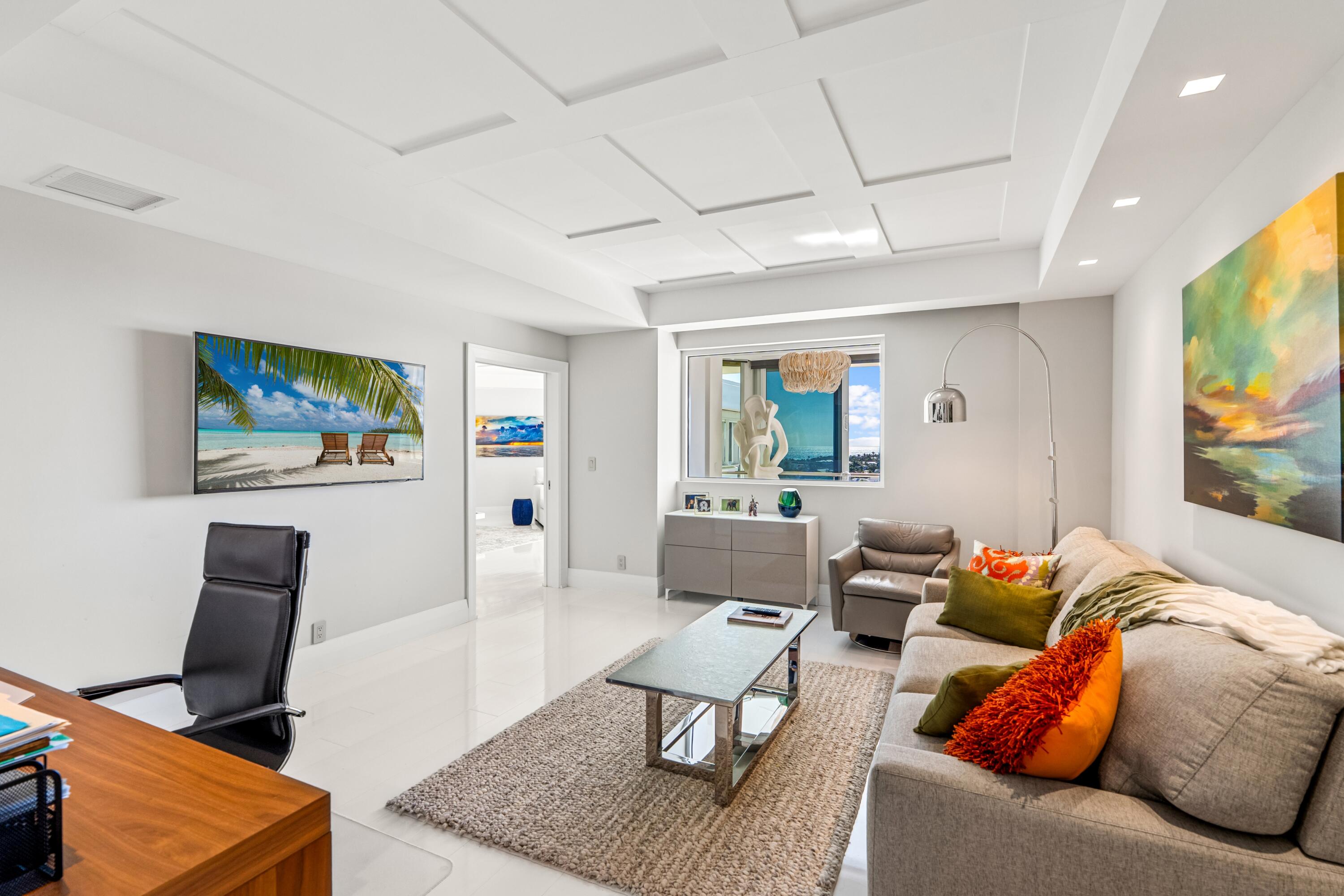 50 E Road, Unit 12G (PENTHOUSE) Delray Beach, FL 33483 - Photo 46 of 75 a living room with furniture and a flat screen tv