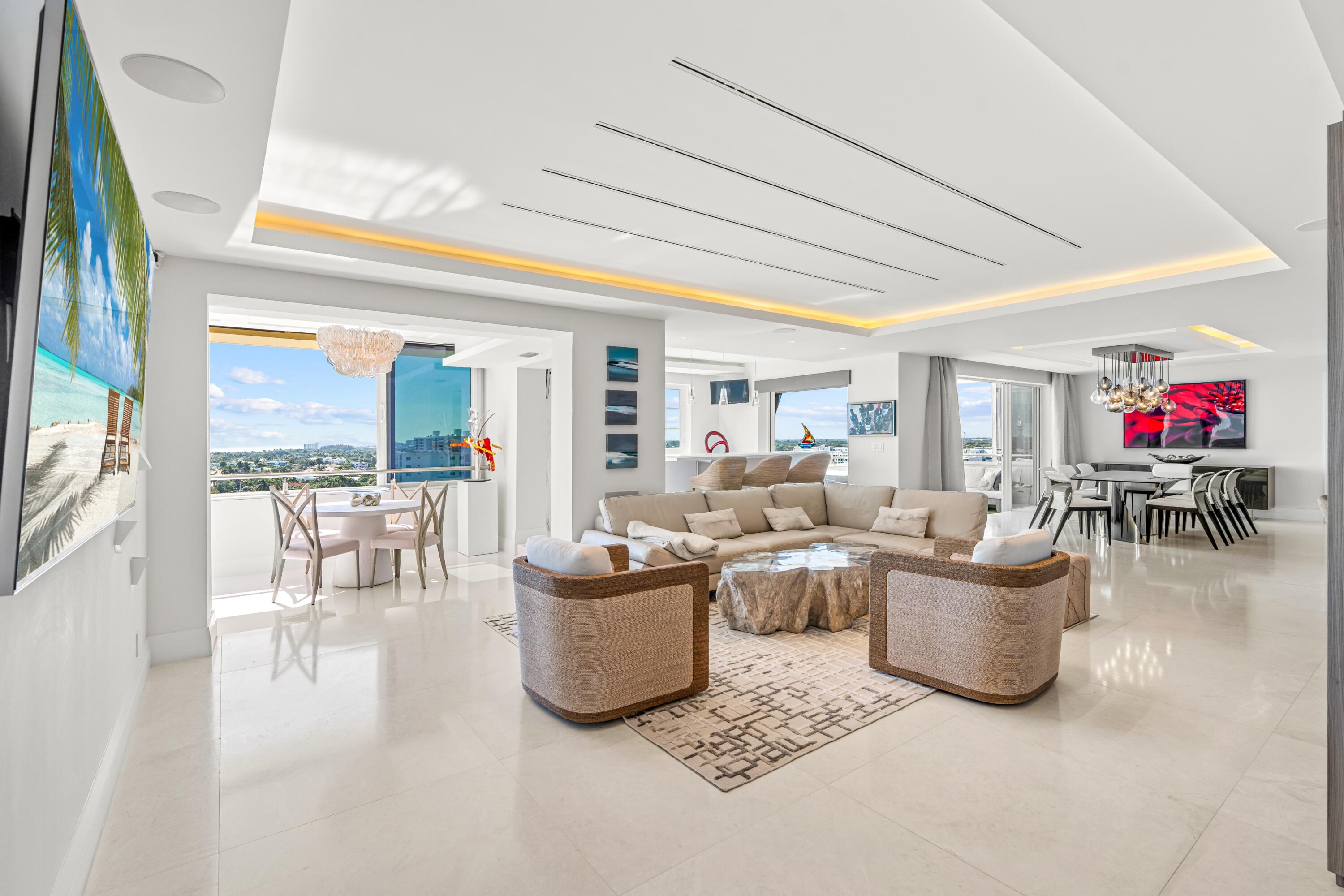 50 E Road, Unit 12G (PENTHOUSE) Delray Beach, FL 33483 - Photo 6 of 75 a living room with furniture and a floor to ceiling window