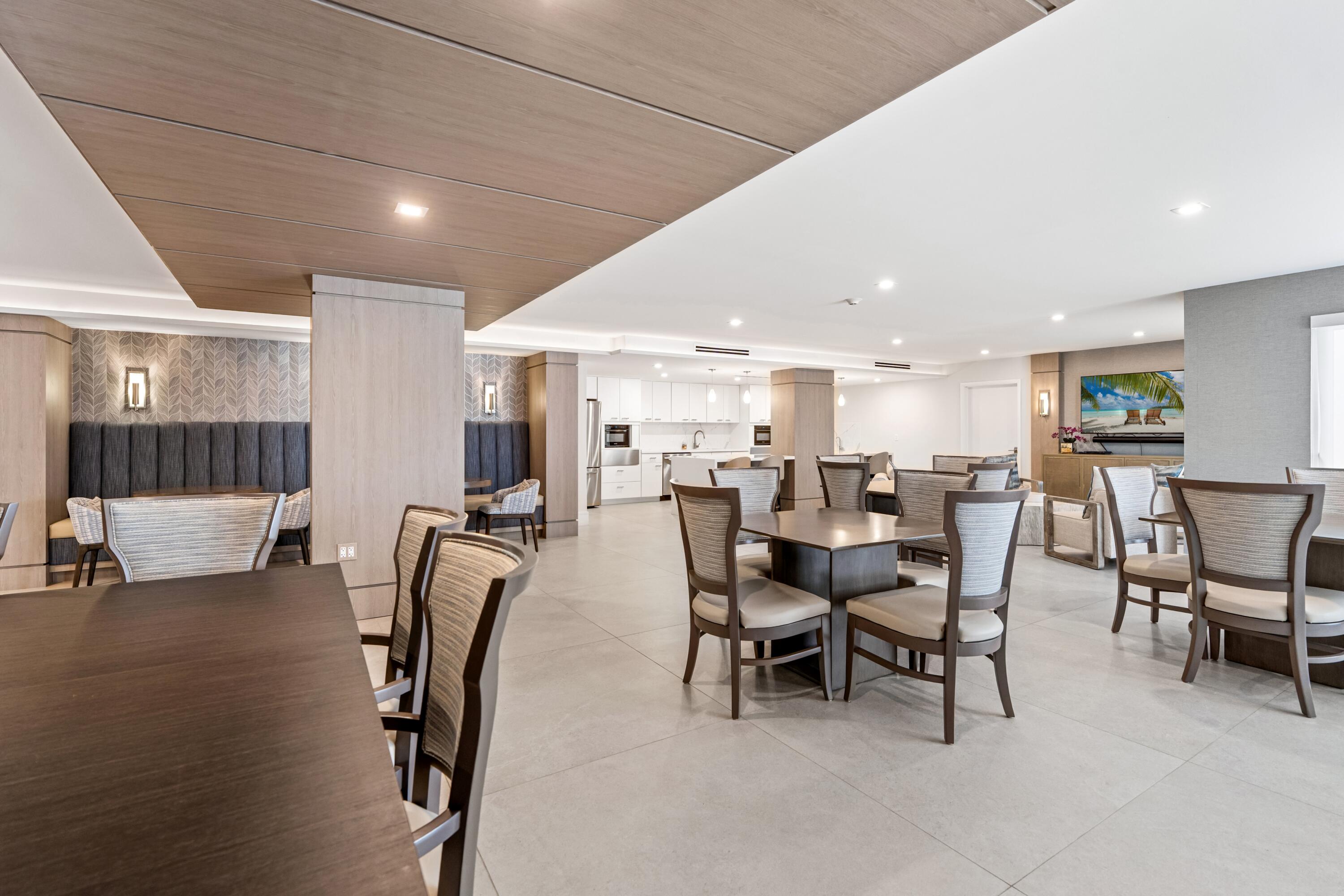 50 E Road, Unit 12G (PENTHOUSE) Delray Beach, FL 33483 - Photo 61 of 75 a dining room with furniture and a rug