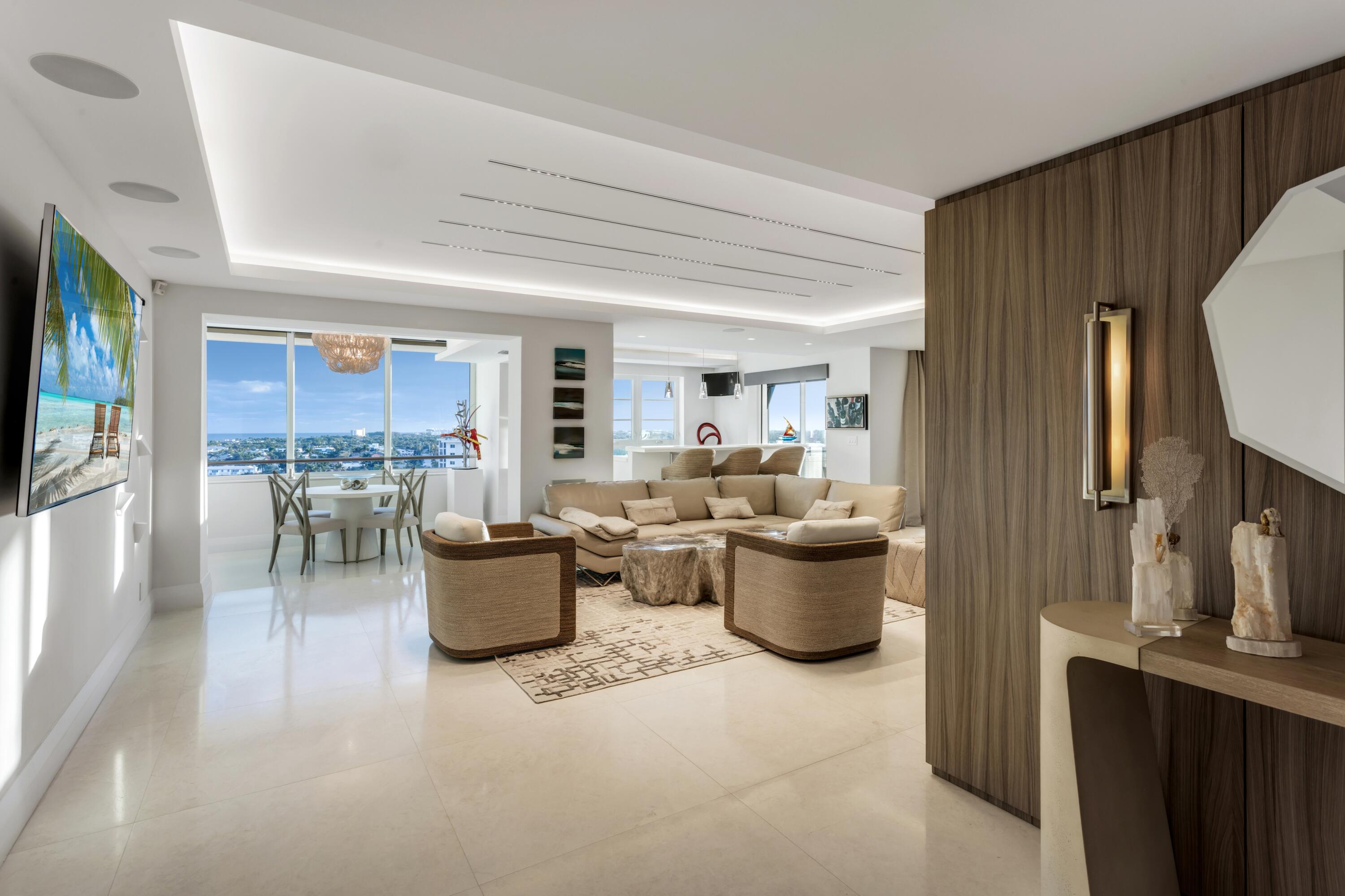 50 E Road, Unit 12G (PENTHOUSE) Delray Beach, FL 33483 - Photo 7 of 75 a living room with furniture and a flat screen tv