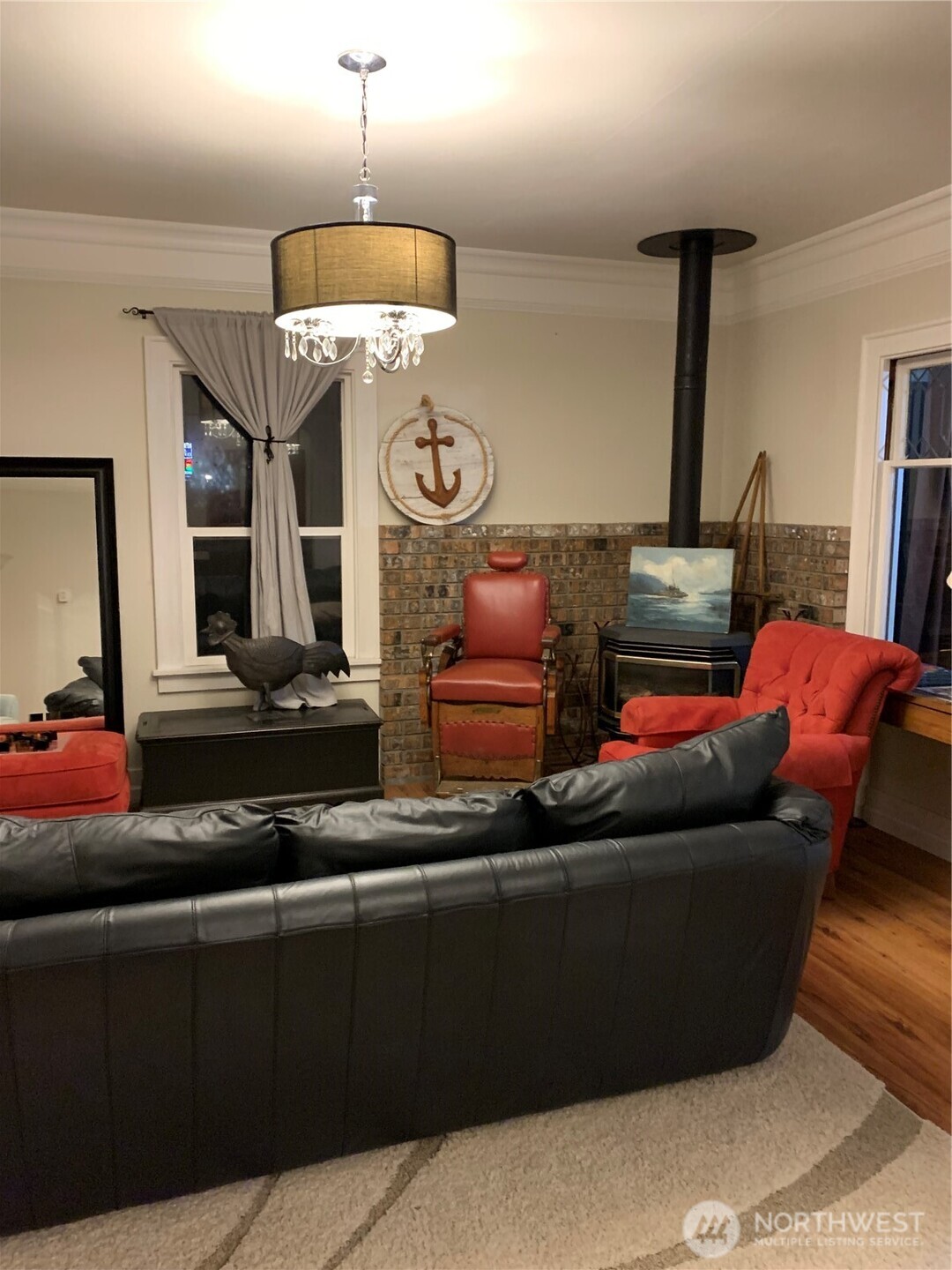 465 Tyee Drive Point Roberts, WA 98281 - Photo 16 of 19 a living room with furniture and a chandelier