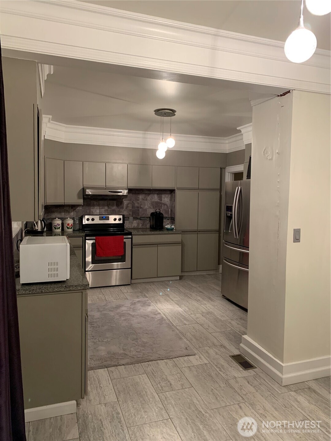465 Tyee Drive Point Roberts, WA 98281 - Photo 8 of 19 a kitchen with refrigerator and cabinets