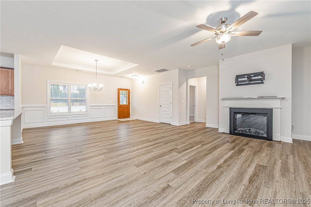 1105 Wolf Pne Court Fayetteville, NC 28311 - Photo 11 of 36 a view of empty room with wooden floor and fireplace