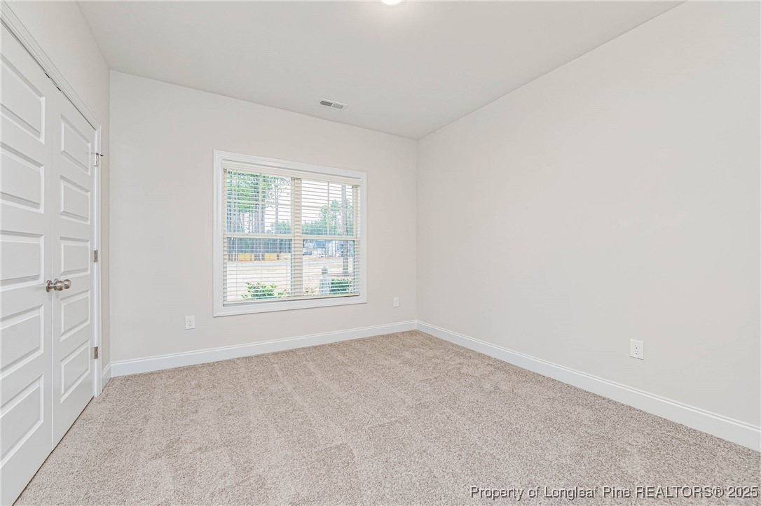 1105 Wolf Pne Court Fayetteville, NC 28311 - Photo 14 of 36 an empty room with a window
