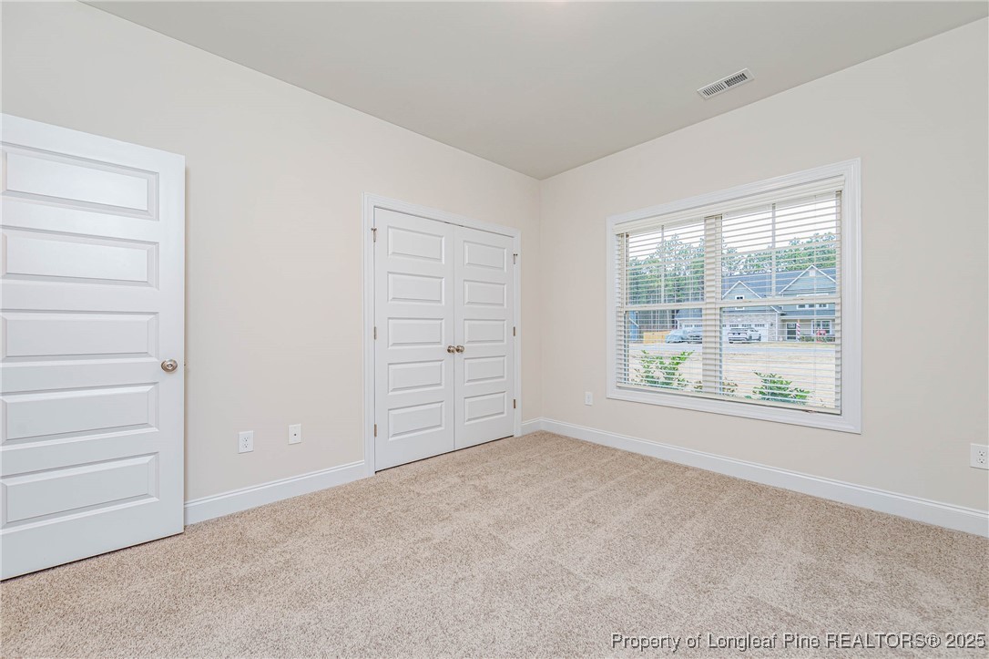 1105 Wolf Pne Court Fayetteville, NC 28311 - Photo 15 of 36 an empty room with windows and closet